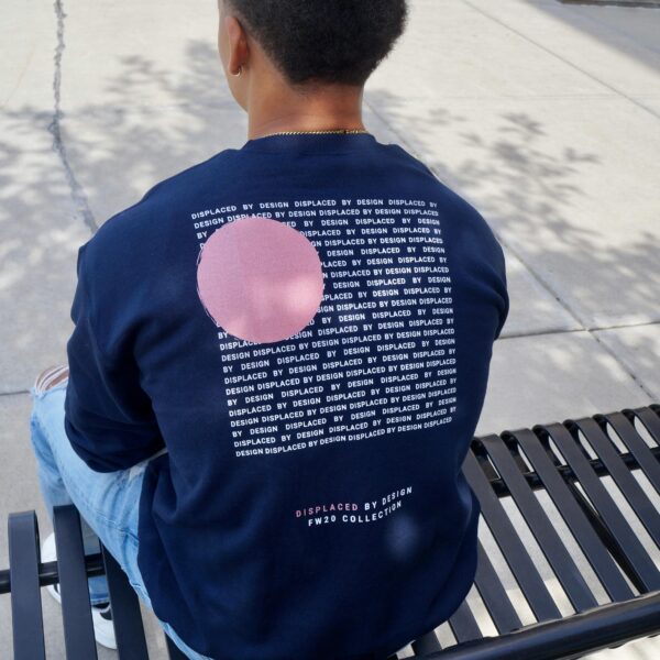 Back View of a Man Sitting on a Bench